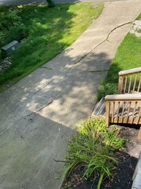 Concrete driveway is in bad condition- cracked and broken