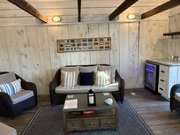 Lounge area, water, coffee machine, wine