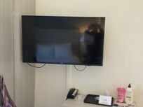 TV with the desk phone chair