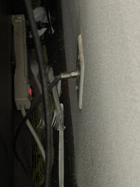 Behind TV console