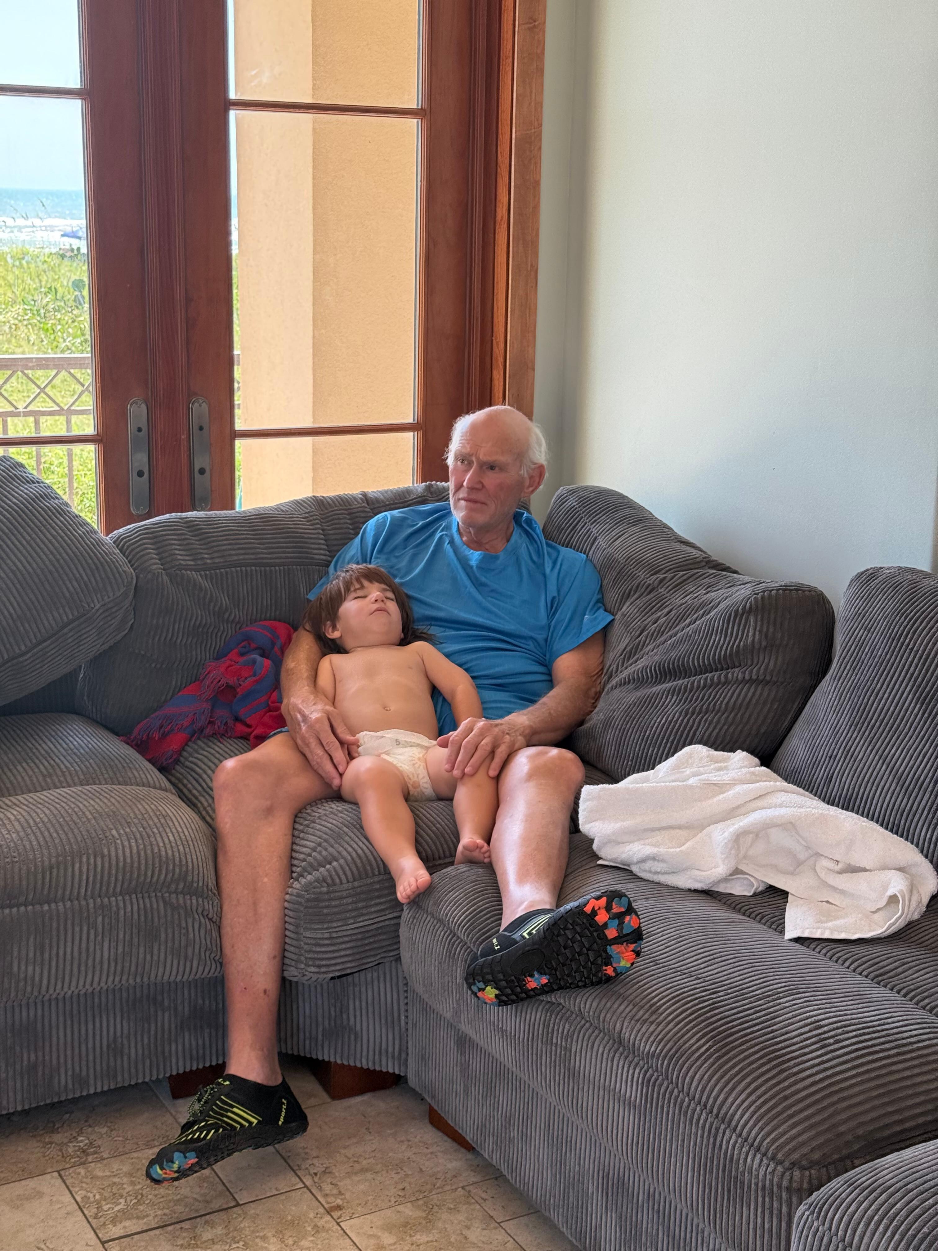 Comfy large sectional couch were grandpa put the 2 year old yo sleep