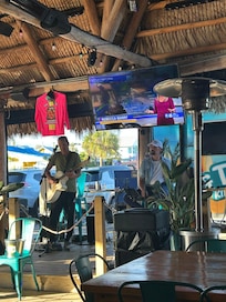 Music during happy hour at Tiki Bar associated with hotel