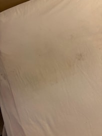 Black stain and dog foot prints