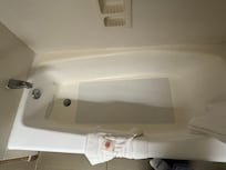 Tub mat, hoping replaced after every stay. Didn't look to see what it was hiding.