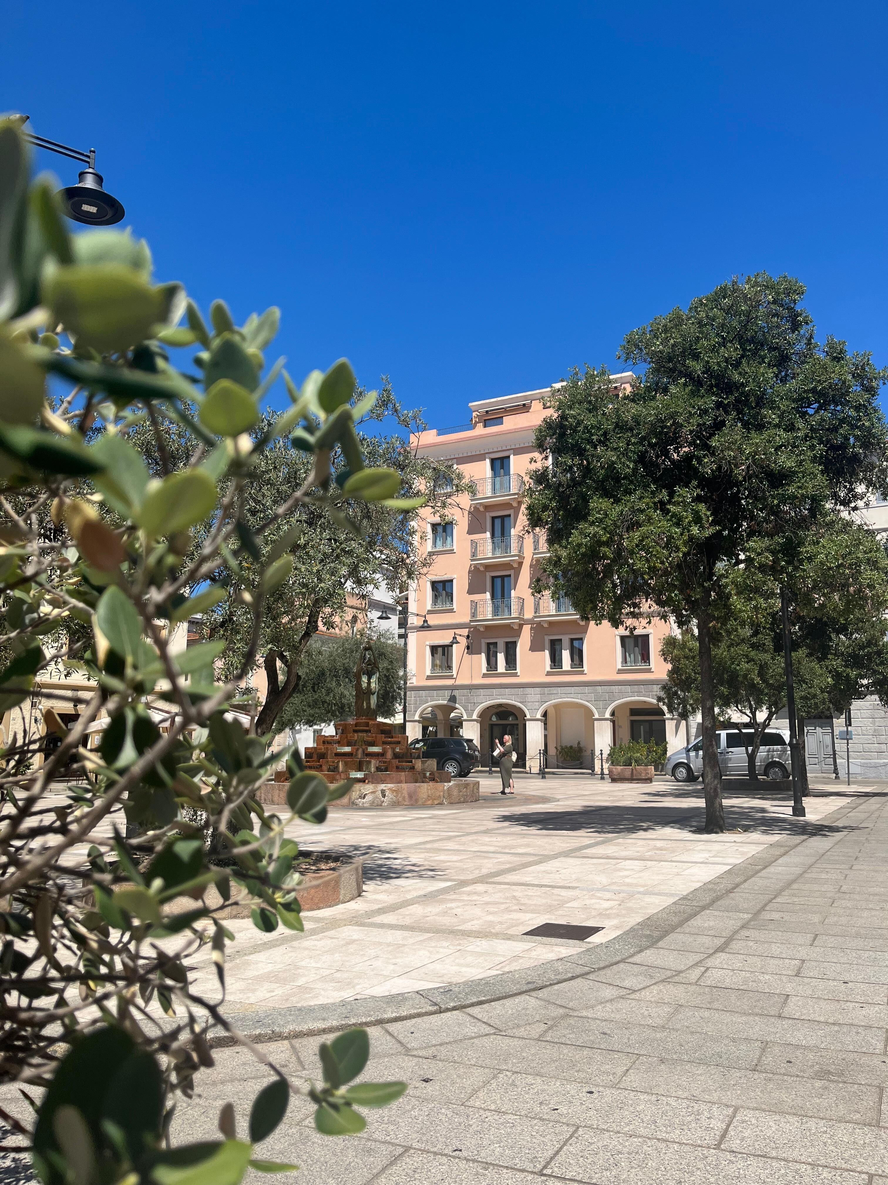 Piazza square with hotel. 