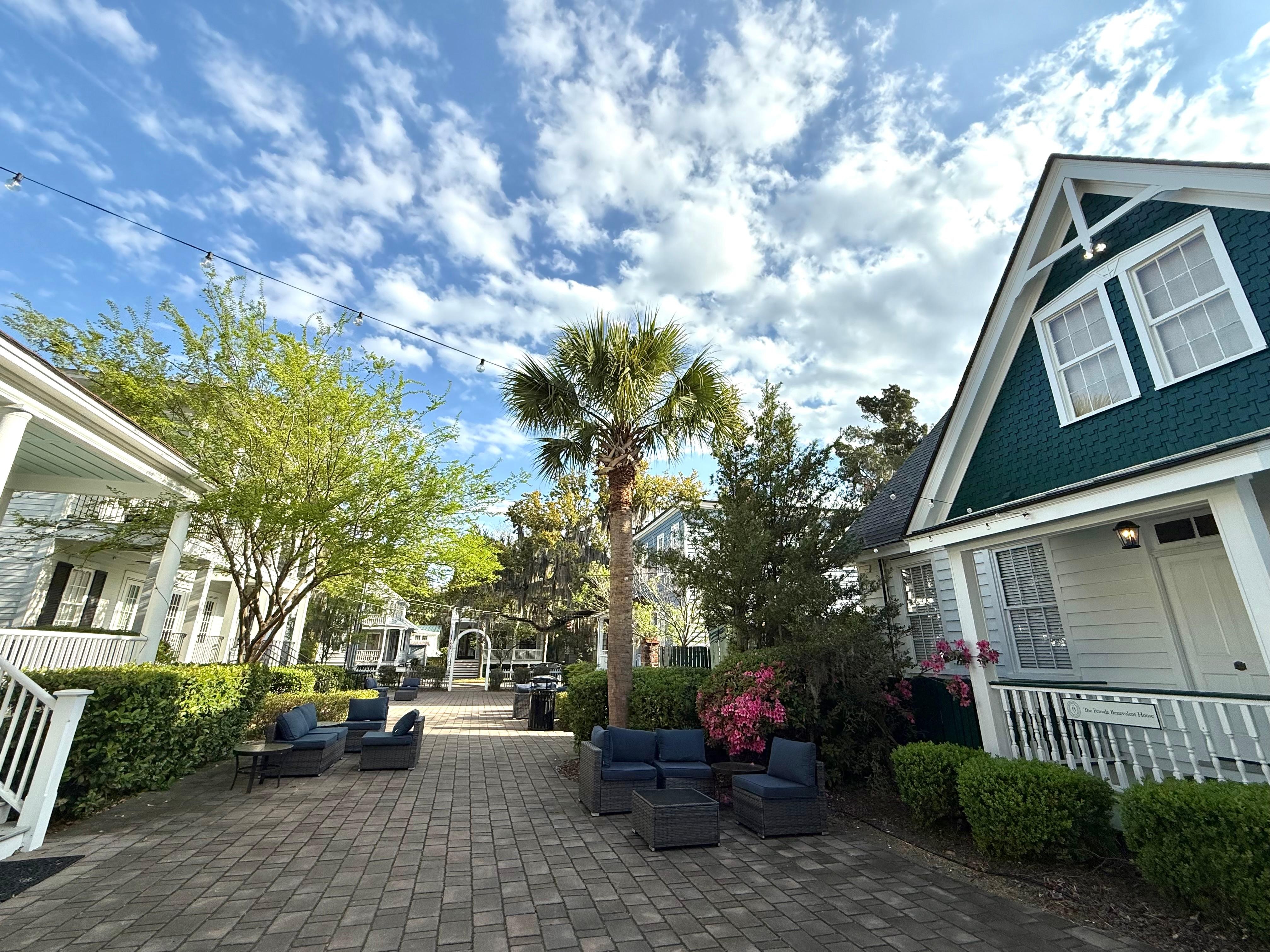 People enjoyed the outdoor furniture at night mingling with other guests passing by