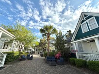 People enjoyed the outdoor furniture at night mingling with other guests passing by