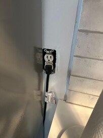 Major building codes violations of missing electrical plug cover!