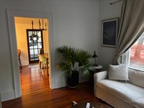 looking from living room to kitchen and dining