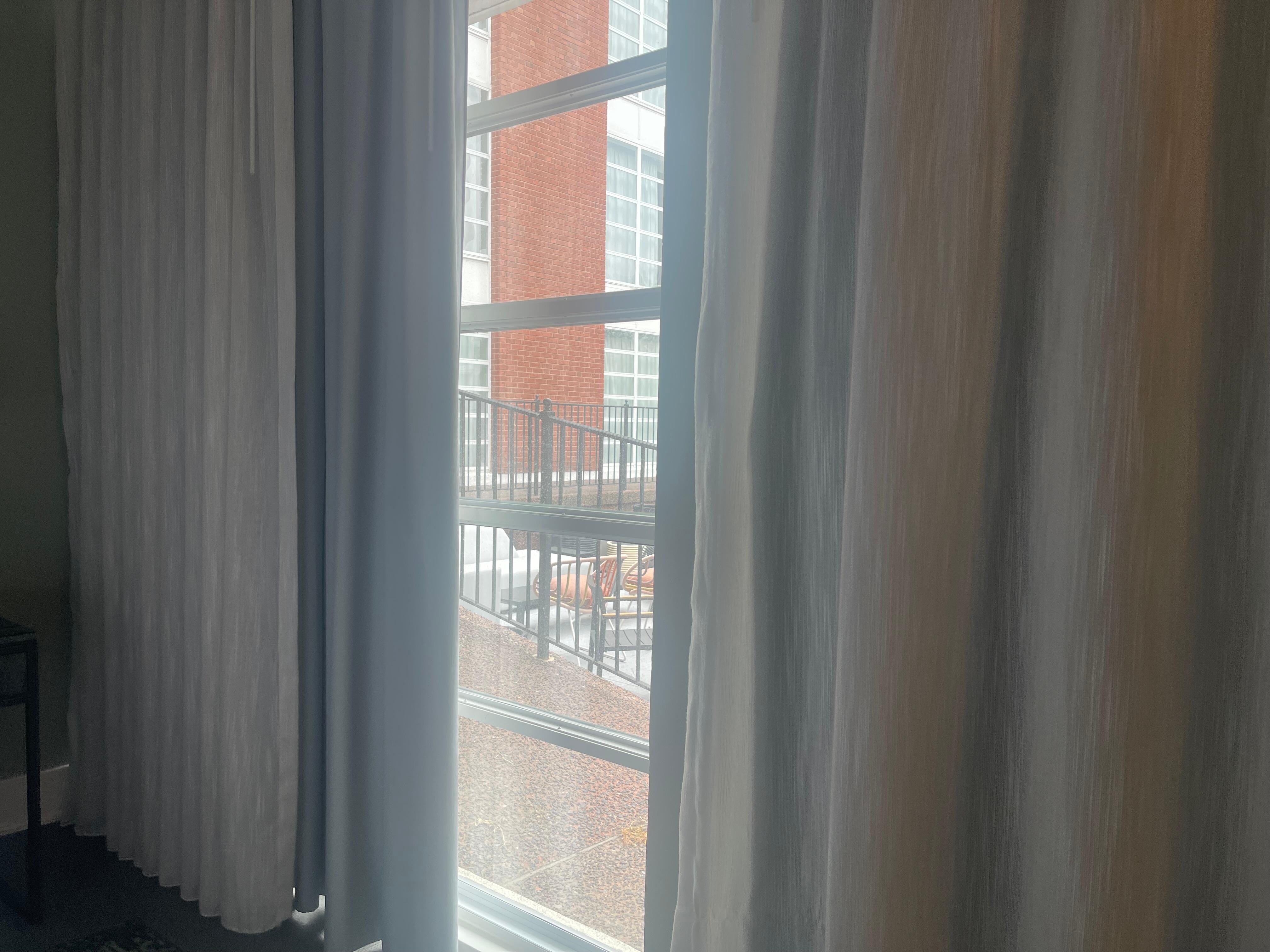 Couldn’t fully open curtains there was outdoor seating outside of window that clearly visible into room from outside.