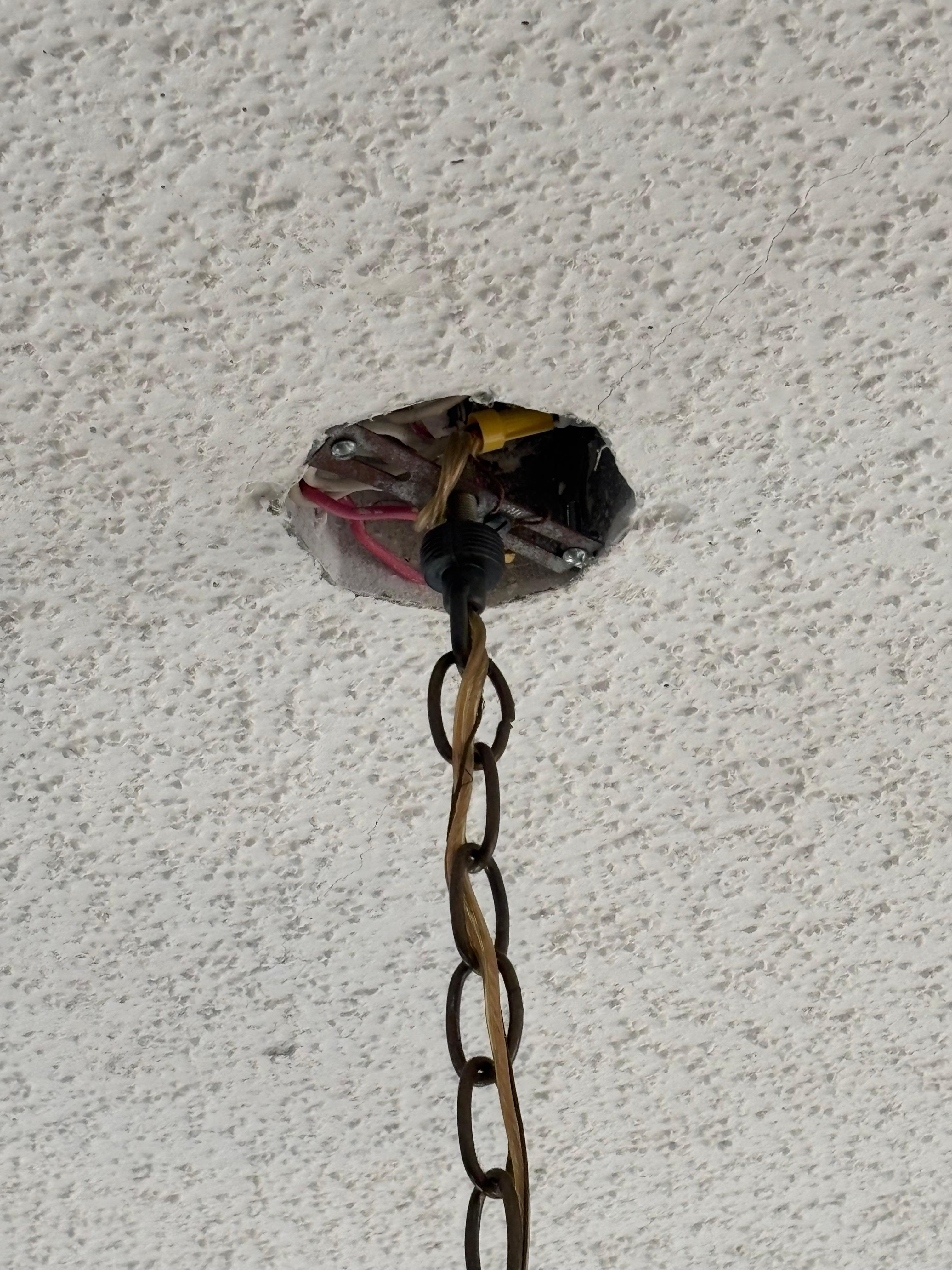 Hole in ceiling at junction box