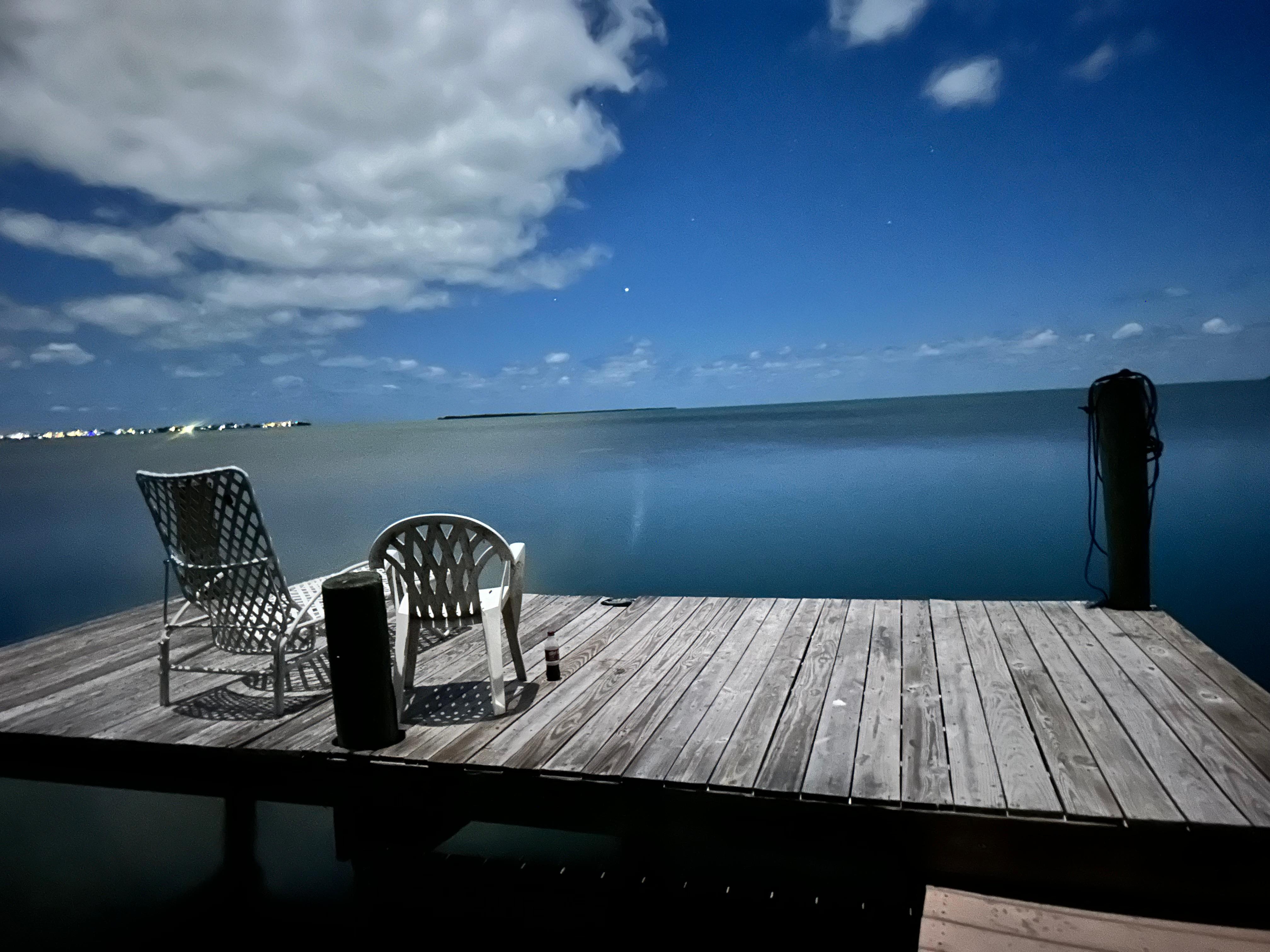 Pier at night under the moonlight 