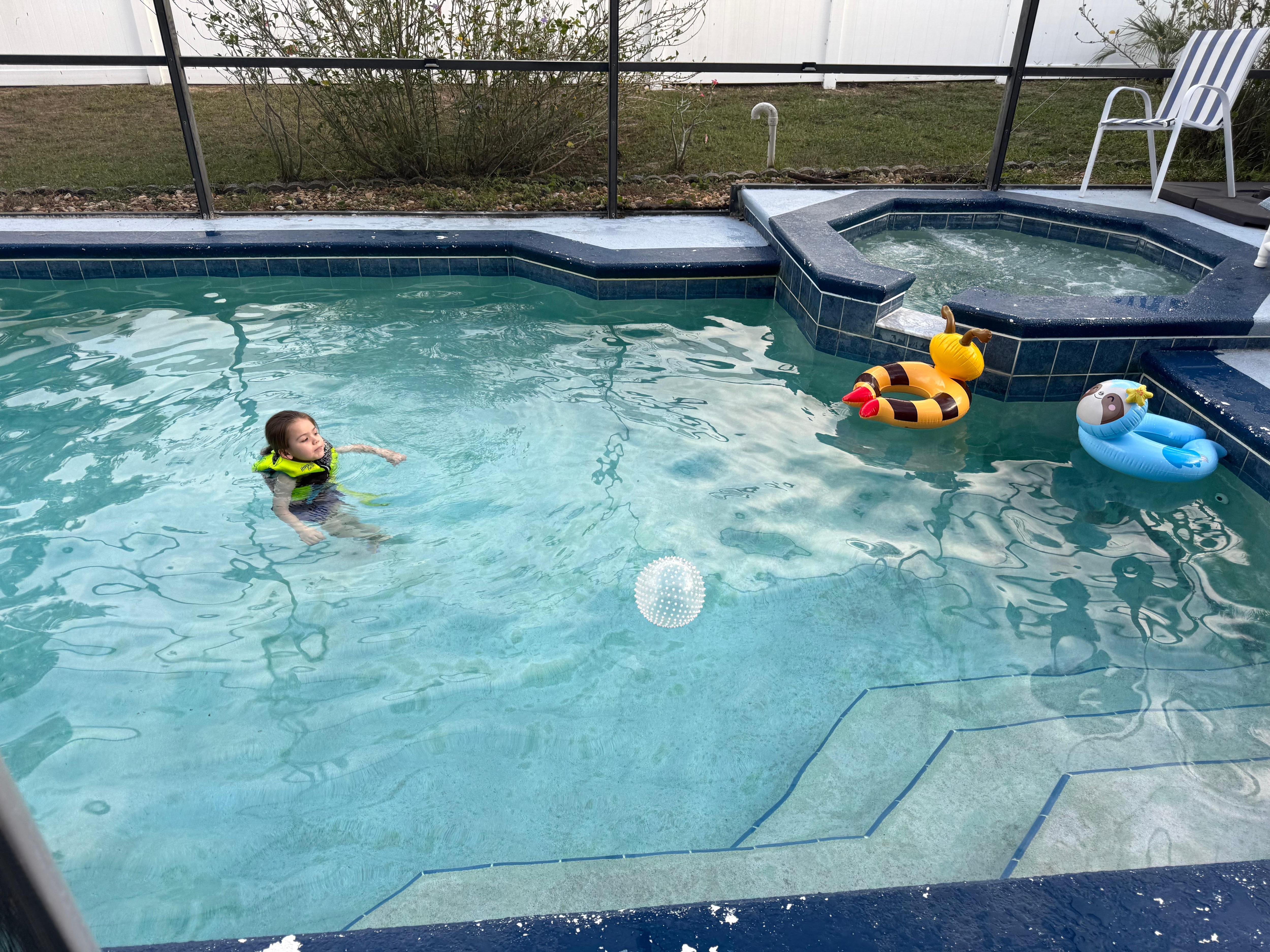 Fun pool area with a safe child fence around it