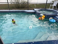 Fun pool area with a safe child fence around it