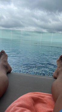 Poolside relaxation viewing the ocean