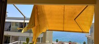 Broken sun blind on balcony