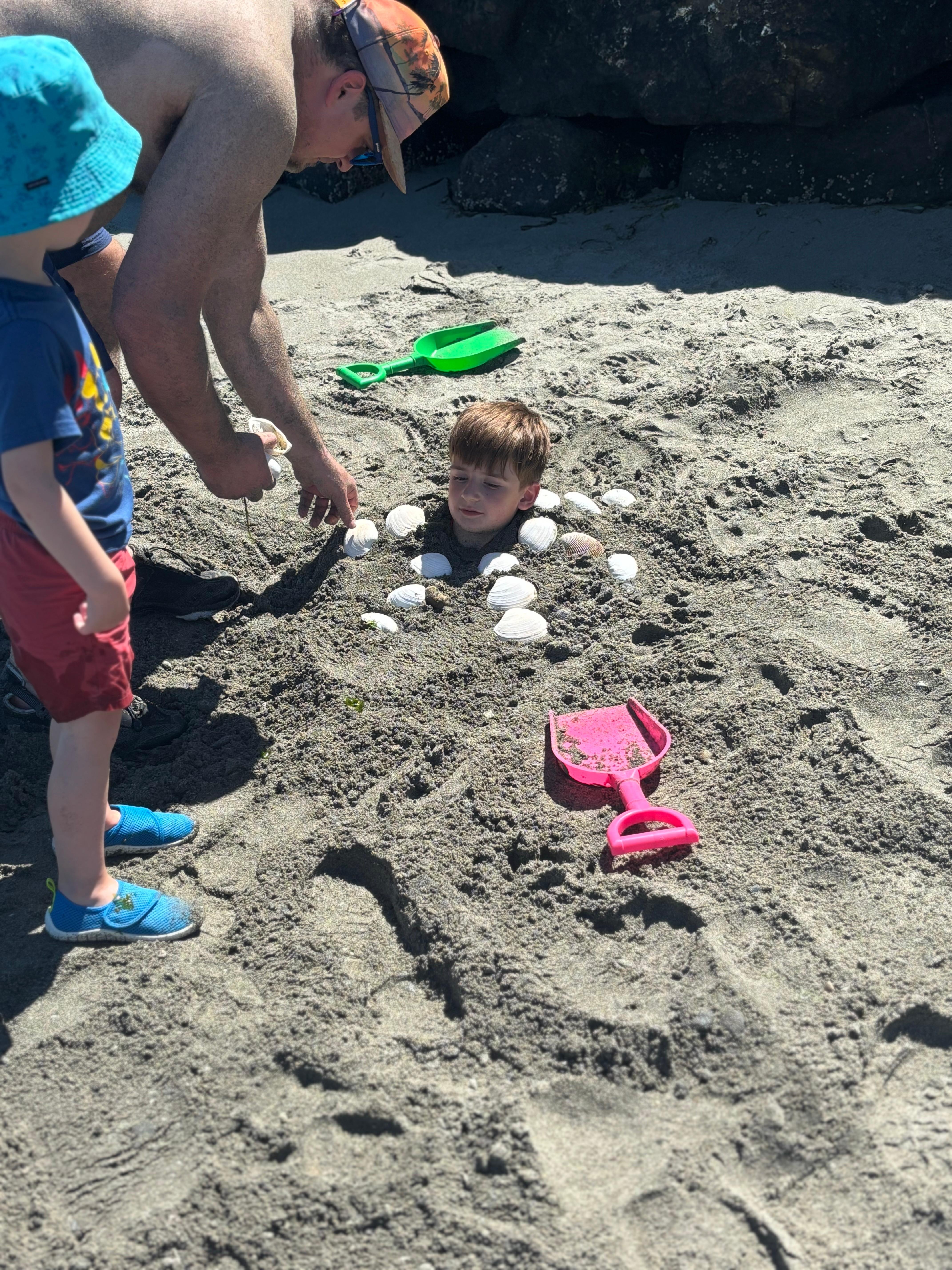 The kids had lots of fun digging holes in the sand and getting “buried”!
