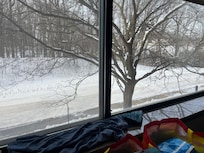 The view from many rooms is of the snowy woods, or Plymouth Creek.