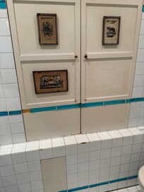 Tatty bathroom with chipped tiles