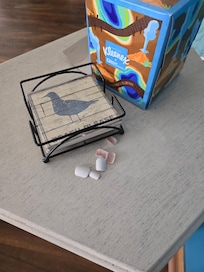 Pile of fingernails hidden under coasters