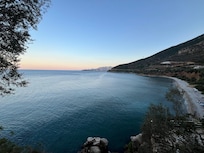 The protected beach below the villas.