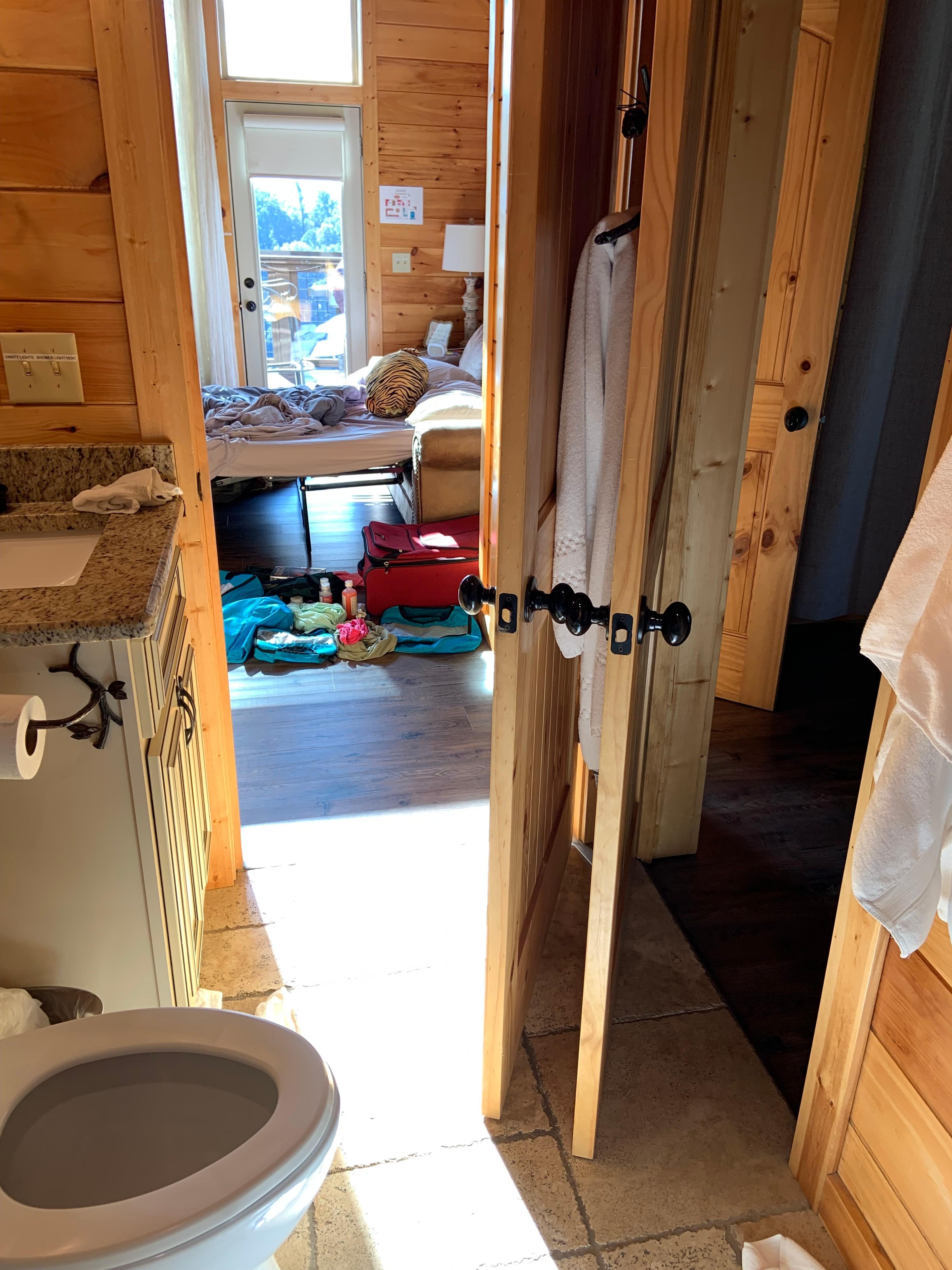 Bathroom doors constantly crashing. They should switch the doors to open outward. 