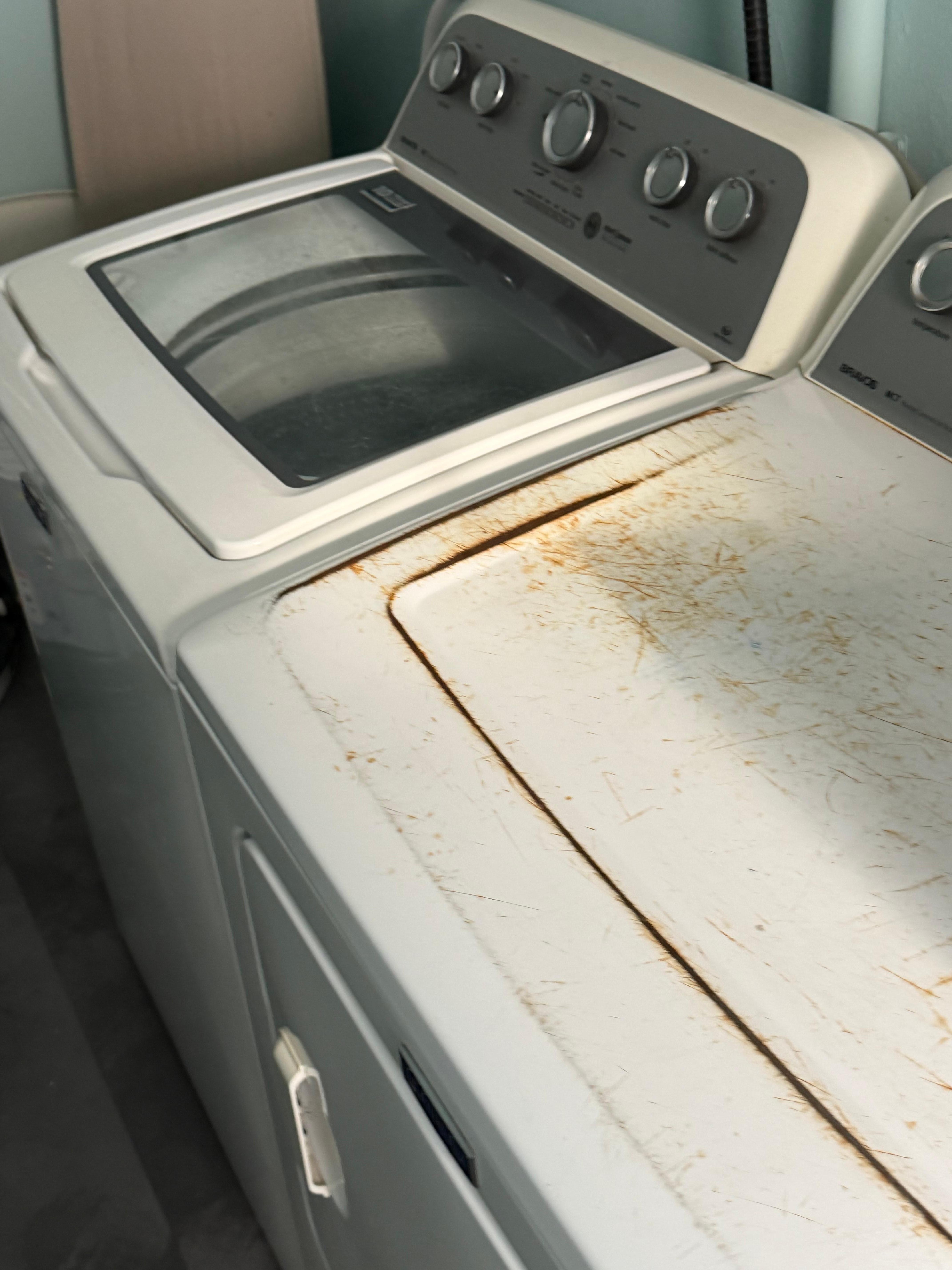 Rusted appliances, no button on dryer 