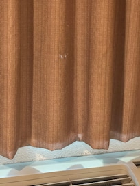 There were holes in the curtains.