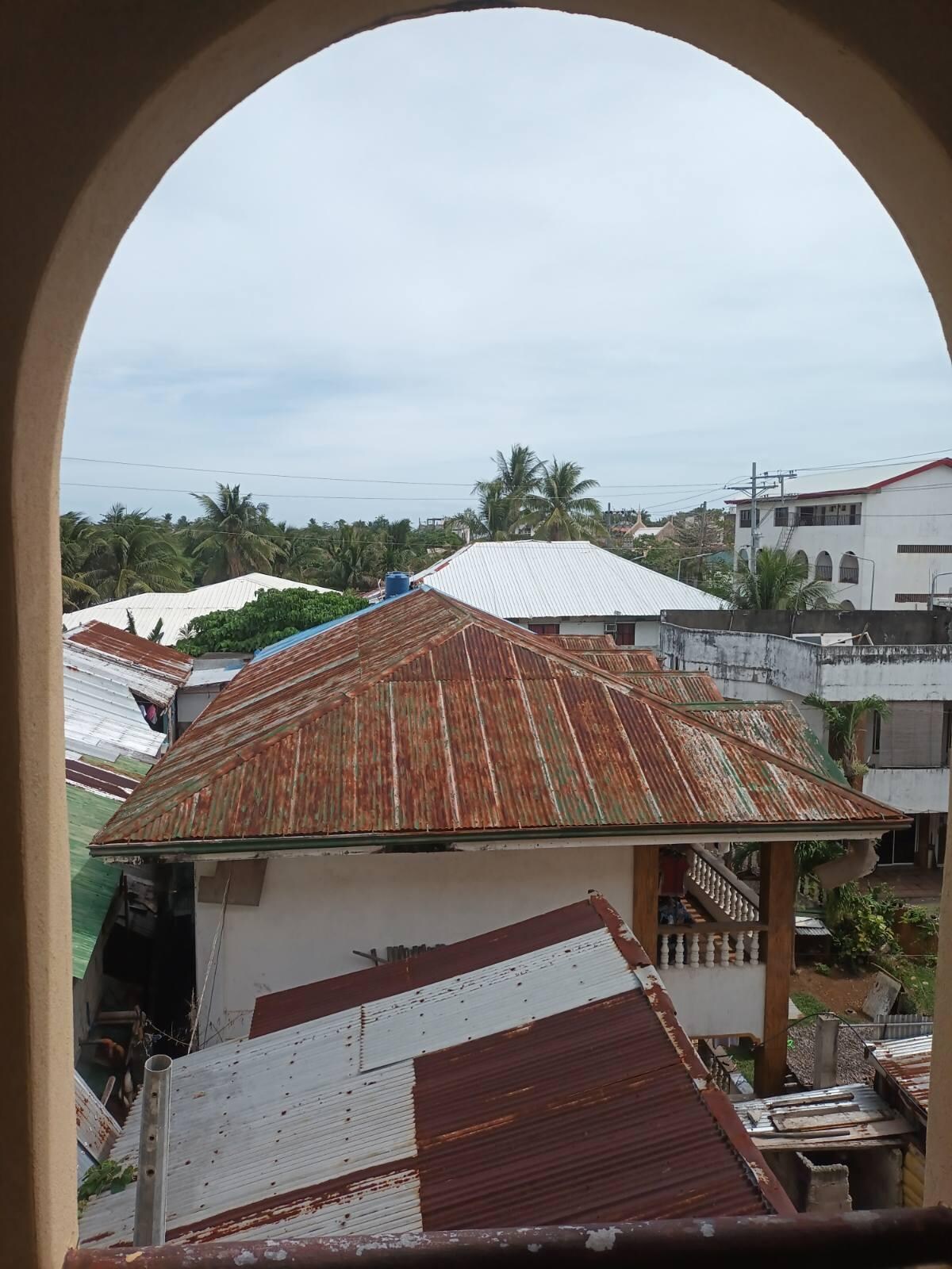 Don't mind the rusty roof of the neighbor. I am liking that this window faces the sunrise. I prefer this over a unit facing the main road with all its noise.