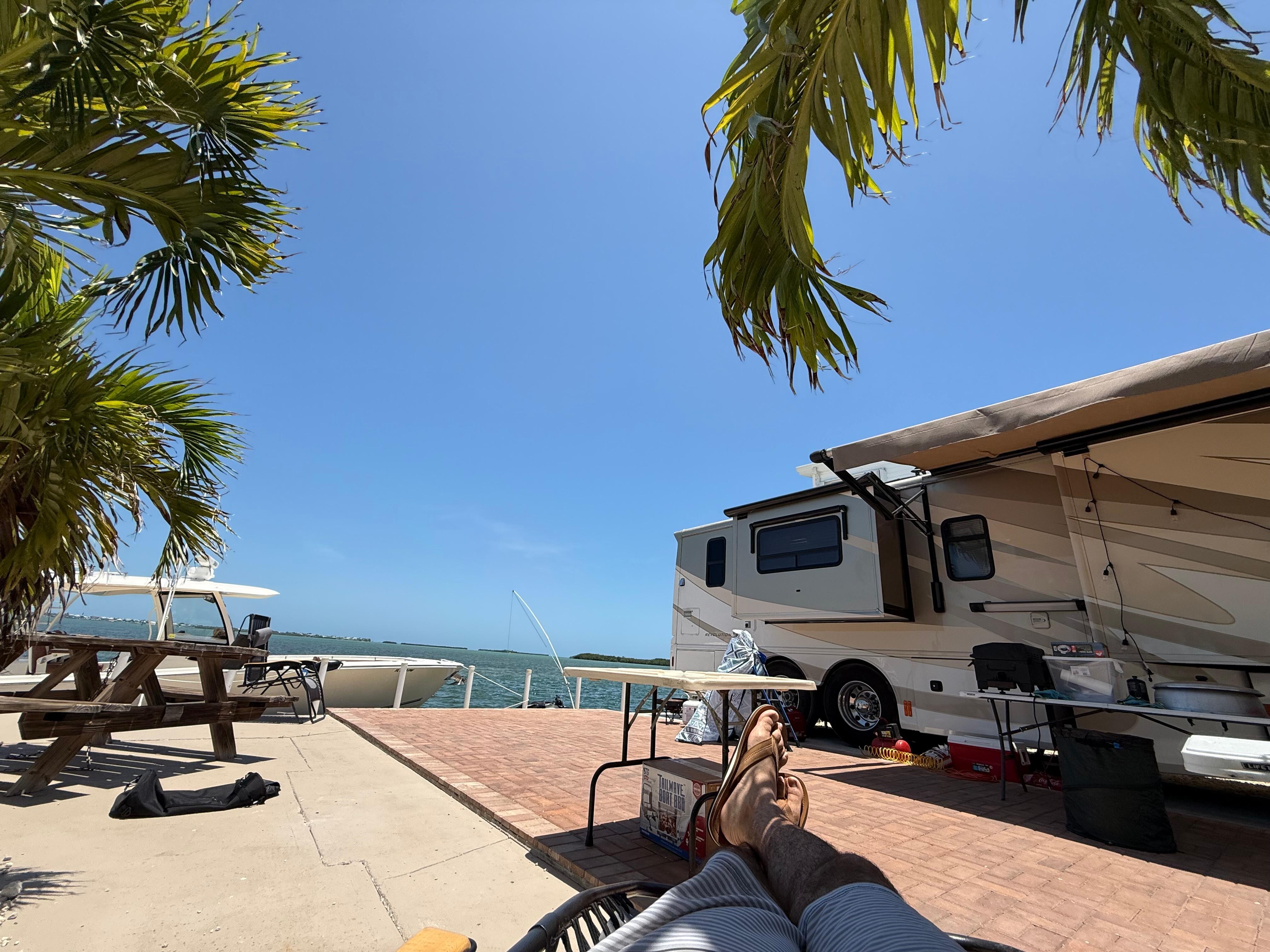 Sitting under the palms enjoying the breeze and beautiful view 