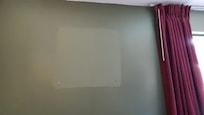 Room needing painting from a removed picture