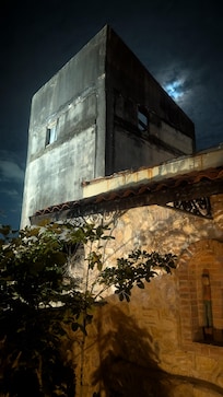Window view - moon behind the classic architecture and historic site. Beautiful!