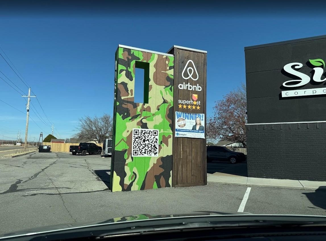 Trash can to left of photo