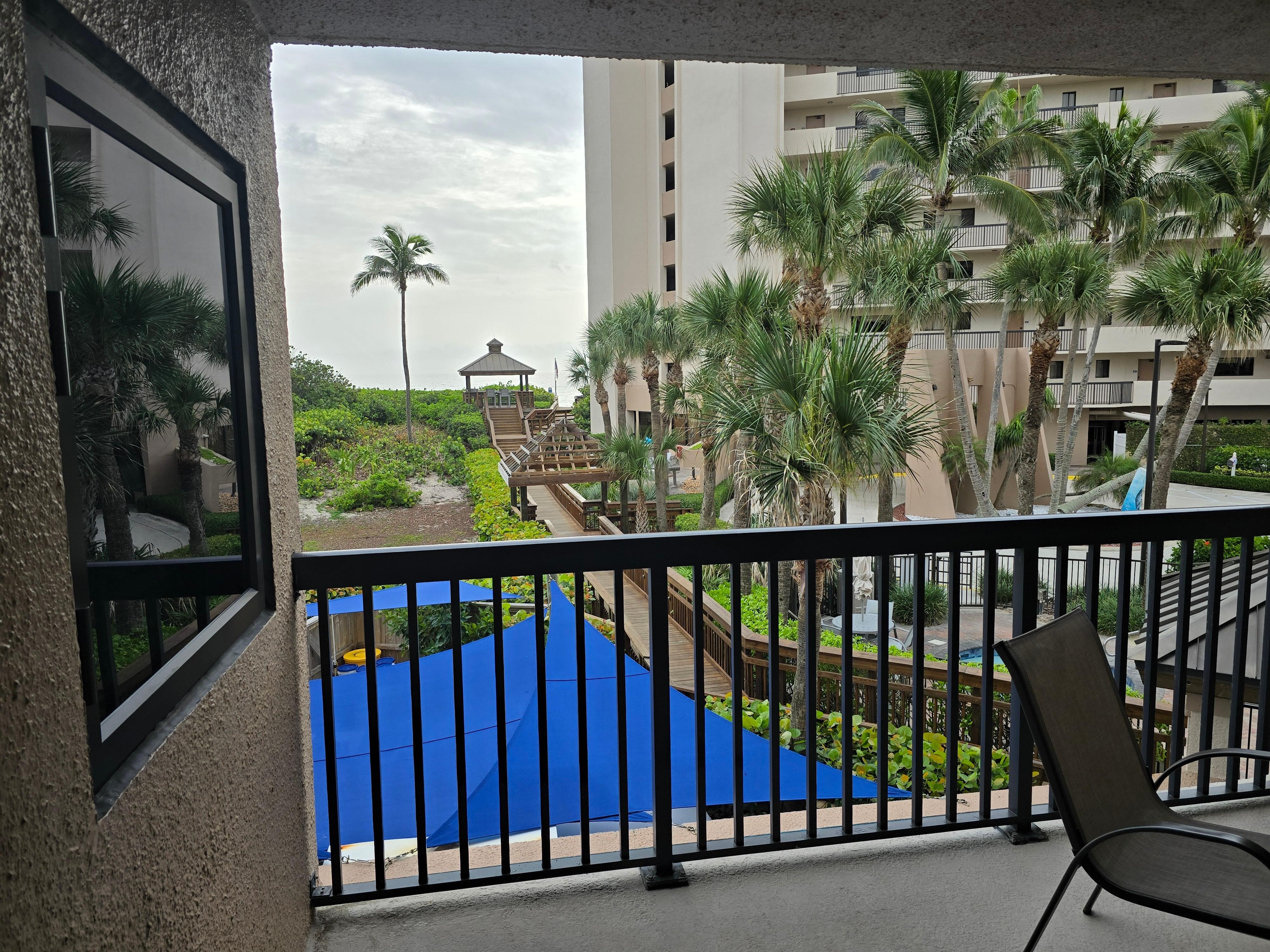 View from 2nd floor balcony, roadside building. Window on left into en-suite bedroom.