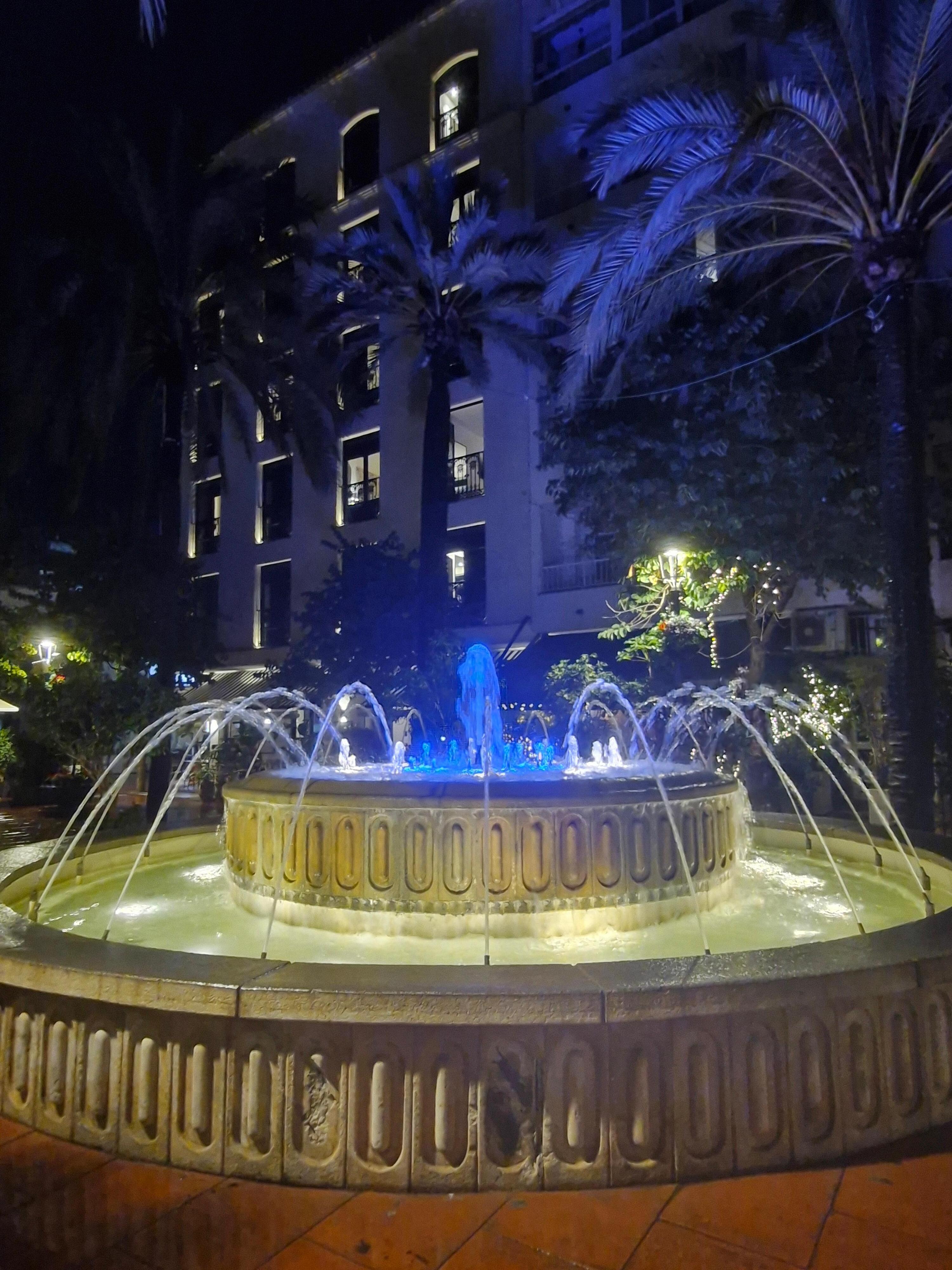 Plaza with hotel in background 

