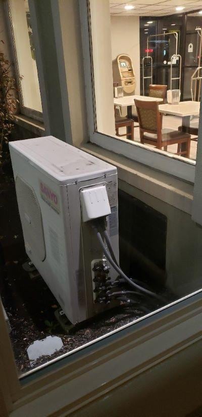 View from ADA room 113 at Days Inn Wilkes-Barre includes hotel reception area with lights that never go off. 