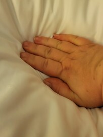 Hand in the hole. My hand was lower than the rest of the mattress.