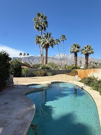 Pool with hot tub in back yard; that’s San Jacinto mountain in the distance. At night we could see light of the tram tower on the top of it.
