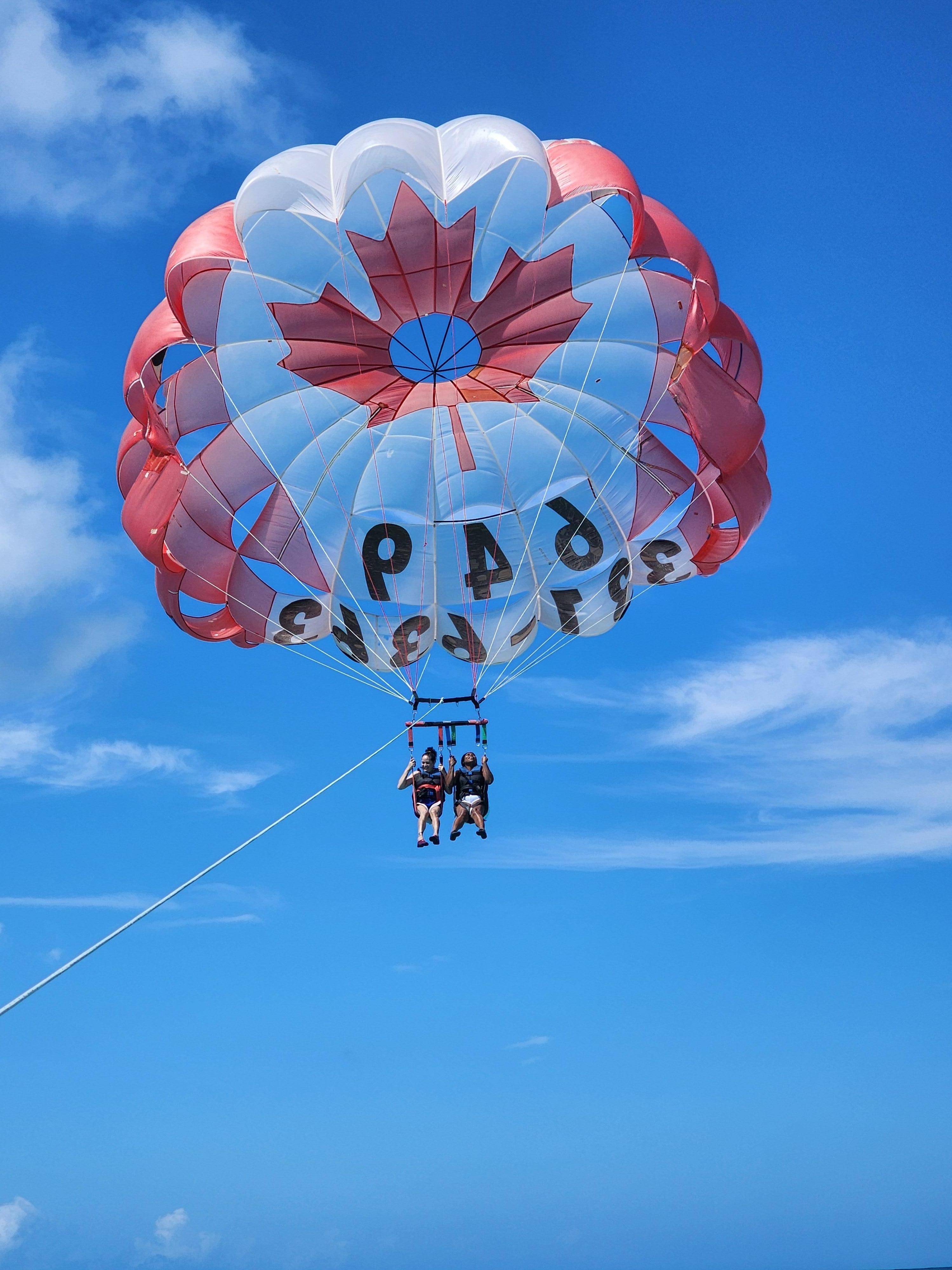 Para sailing around Hotel's Beach area