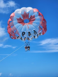 Para sailing around Hotel's Beach area