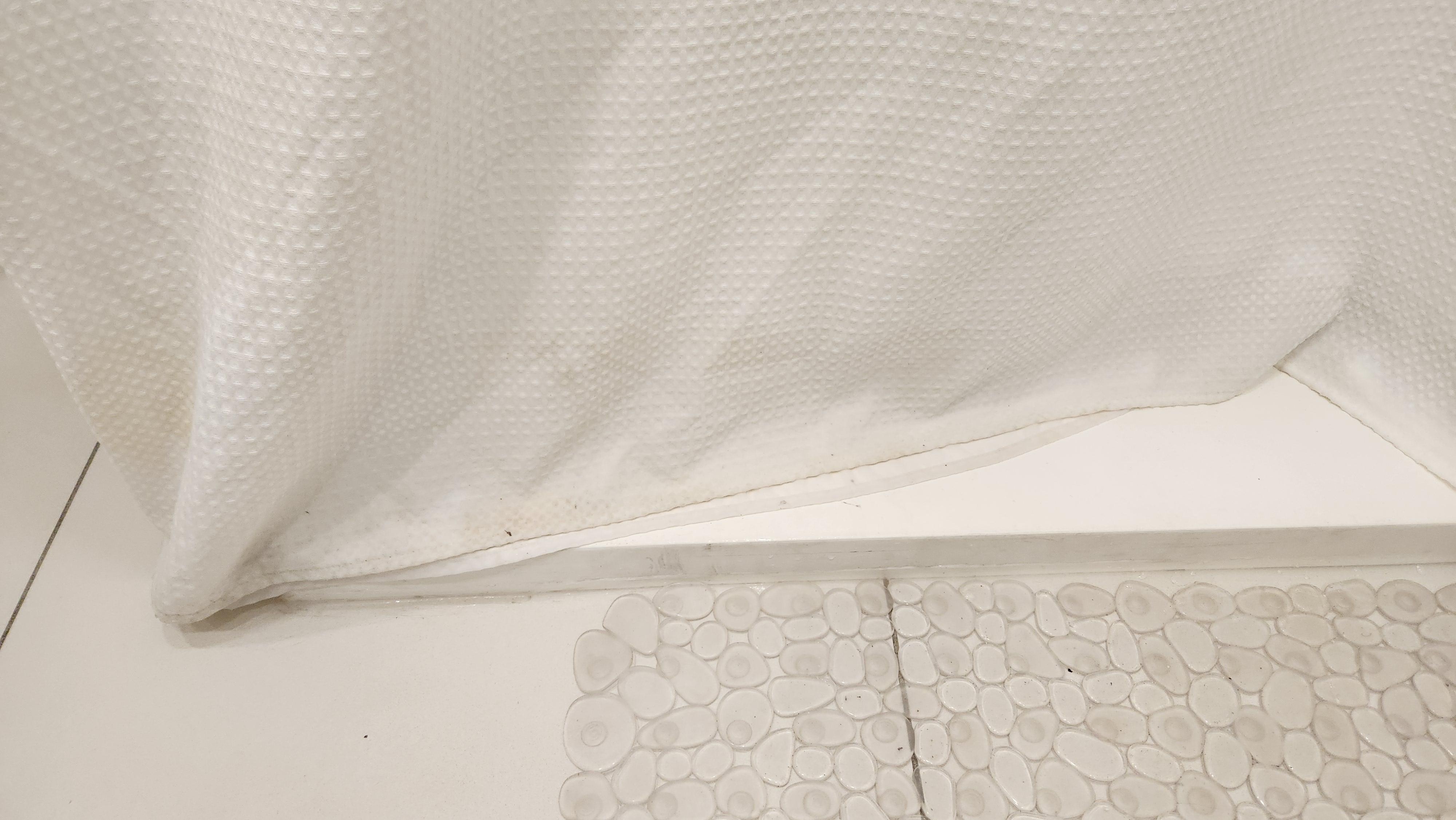 Base of shower curtain 