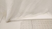 Base of shower curtain