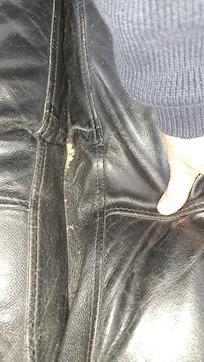 Food scraps from previous occupants between seat cushions on sofas