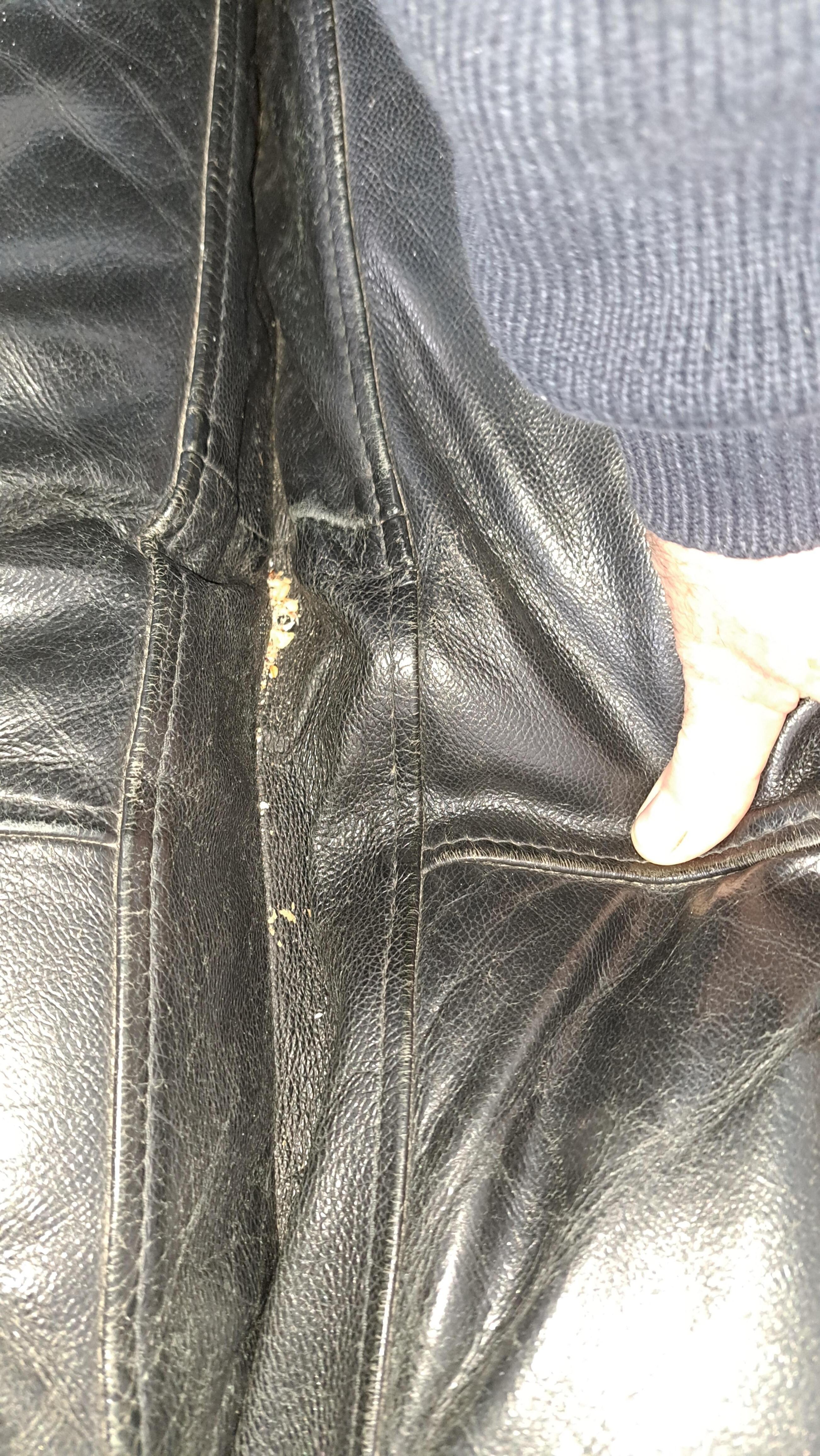 Food scraps from previous occupants between seat cushions on sofas