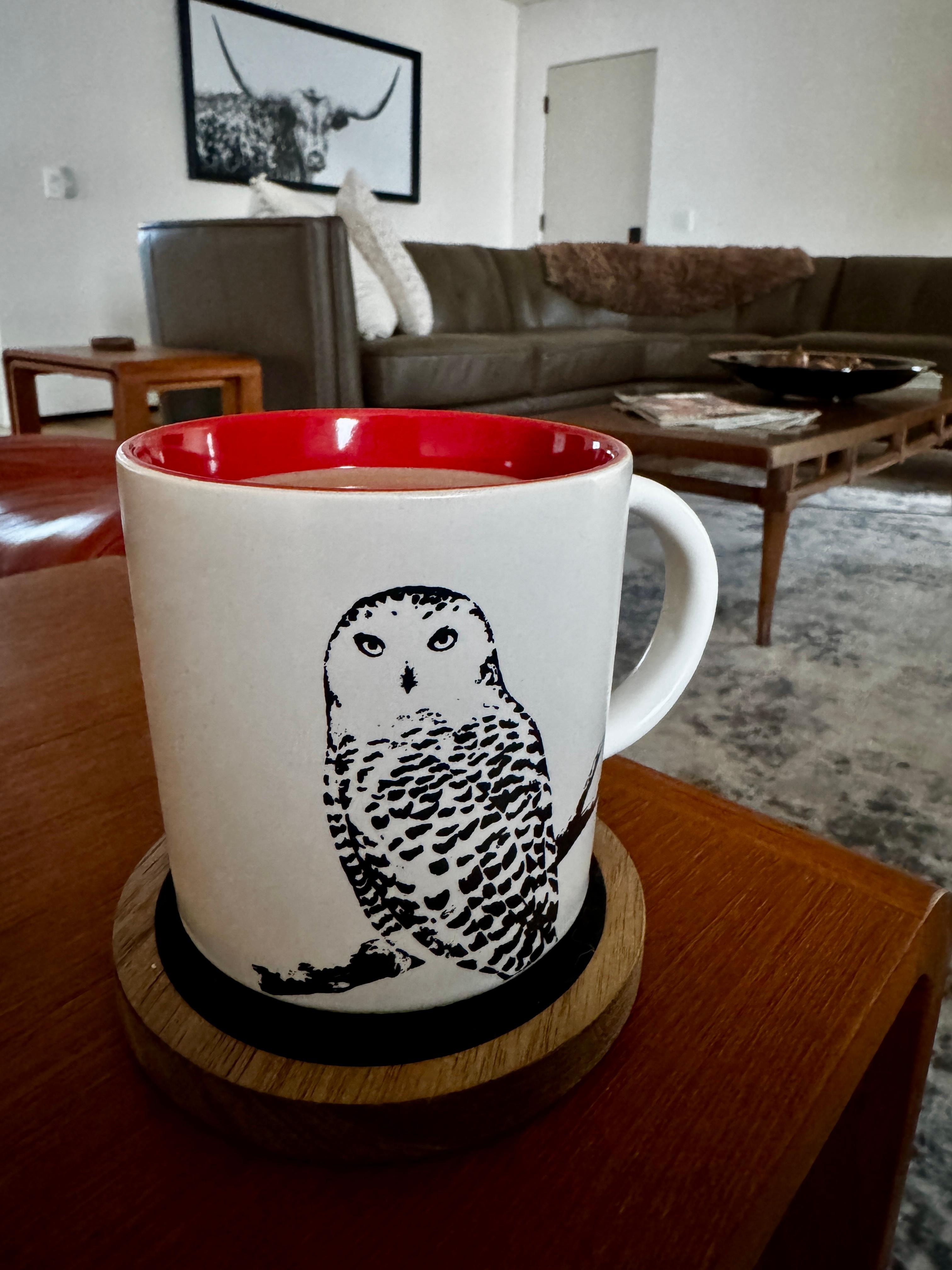 Having a cup of coffee (which was provided) in the great room.