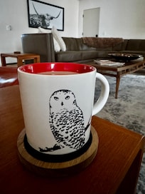 Having a cup of coffee (which was provided) in the great room.