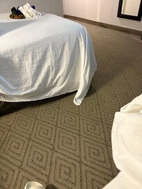 They don’t even make the beds correctly here! Sheets touching the floor!