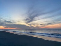 Sunrise on beach in front of Tidewater