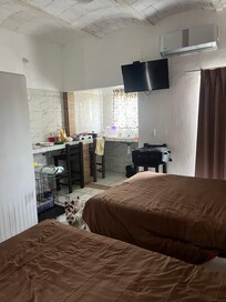 This shows there are two queen beds and a kitchenette