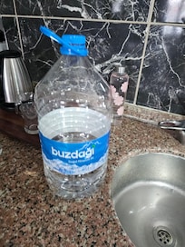 Picture of the bottle we had to lug up as we had to bottled water in  the fridge.